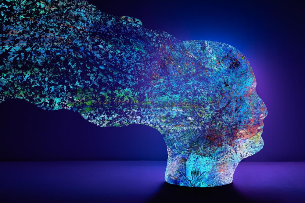 Abstract head with colourful natural elements dissolving around it.