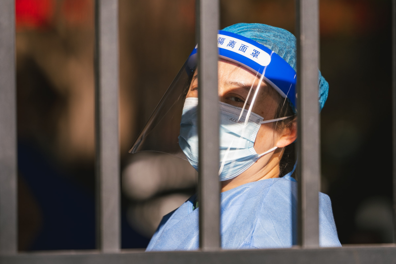 A health worker conducts an RNA test for COVID (in Shenzhen, China)